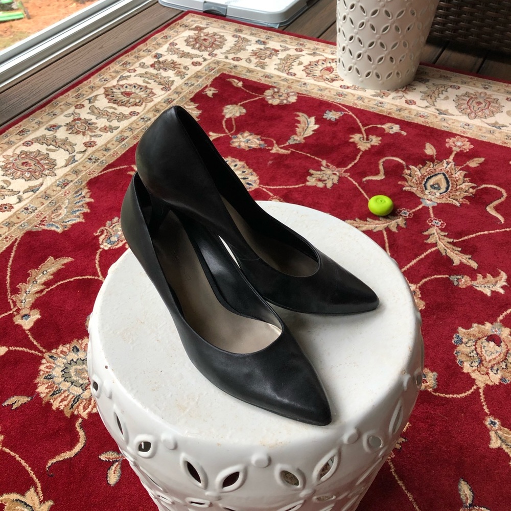 Black leather pumps